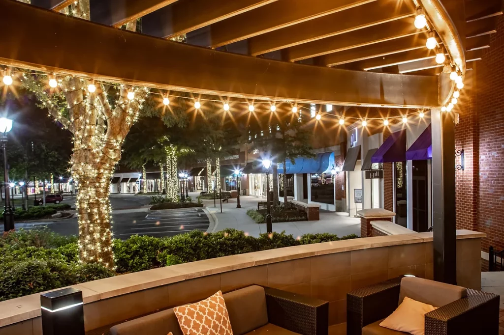 Outdoor patio with string lights at night.