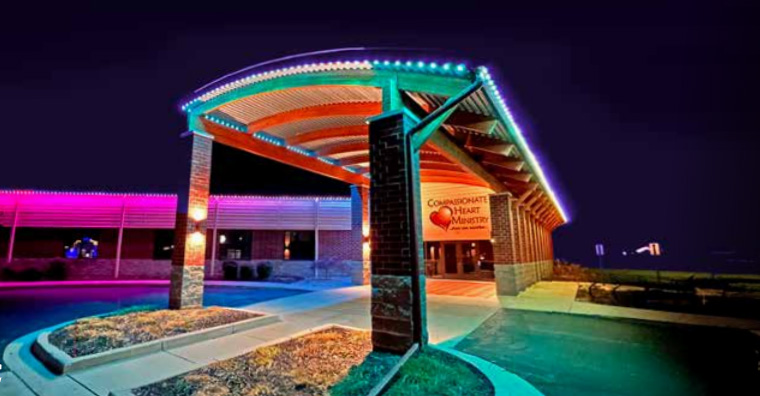 Colorfully lit modern building entrance at night